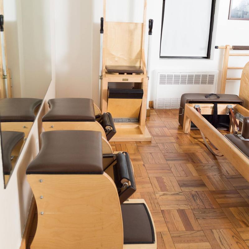 Fully equipped Pilates studio that features Gratz Wunda chairs and high chair on the Upper East Side NYC